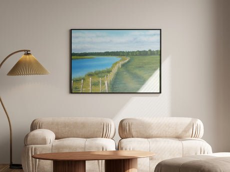 Interior view of a living room showcasing a painting of a scenic rural landscape - MRC Art by Design
